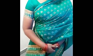 Fantasy Role Adjacent to A Tamil Amma Enervating Green Saree and Inspiriting Her Step Son