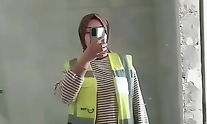 Turkish girl with headscarf who turns on the camera and puts on a show at the organization site